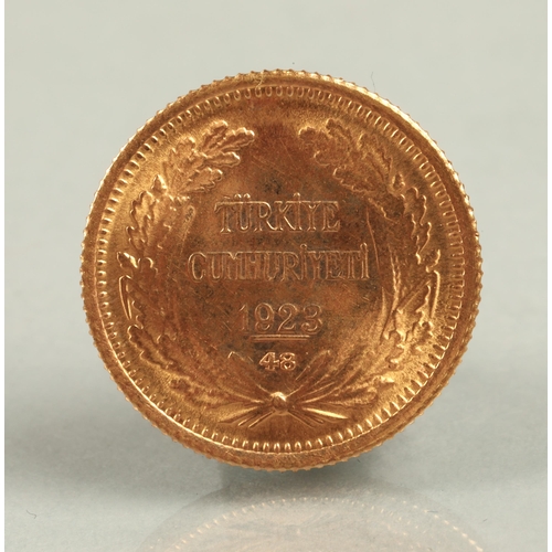 135 - 1923/48 Turkey 100 Kurush gold coin.3.6 grams, 1.8cm diameter