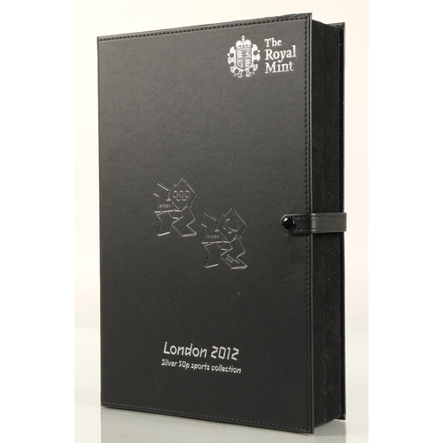 153 - The Royal Mint London 2012 silver 50p sports collection, comprising of twenty nine coins in a leathe... 