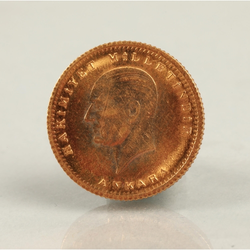 135 - 1923/48 Turkey 100 Kurush gold coin.3.6 grams, 1.8cm diameter