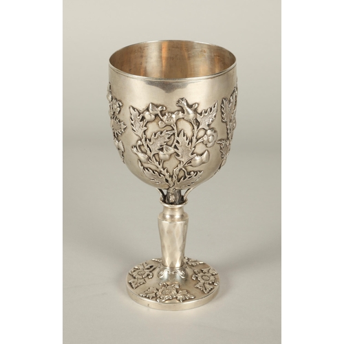 163 - Continental silver goblet decorated with embossed thistles, 18cm high, 298g