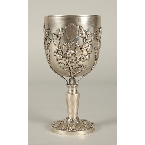 163 - Continental silver goblet decorated with embossed thistles, 18cm high, 298g