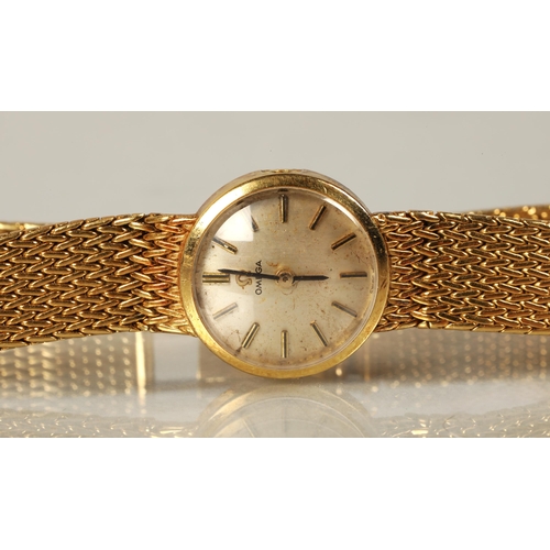 116 - Ladies Omega 18ct gold wristwatch, champagne dial with baton hour markers, dial 1.5cm diameter, 31g,... 