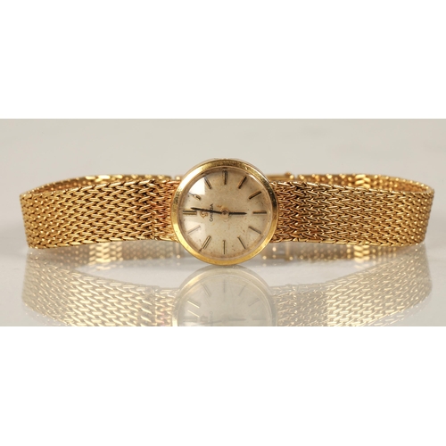 116 - Ladies Omega 18ct gold wristwatch, champagne dial with baton hour markers, dial 1.5cm diameter, 31g,... 