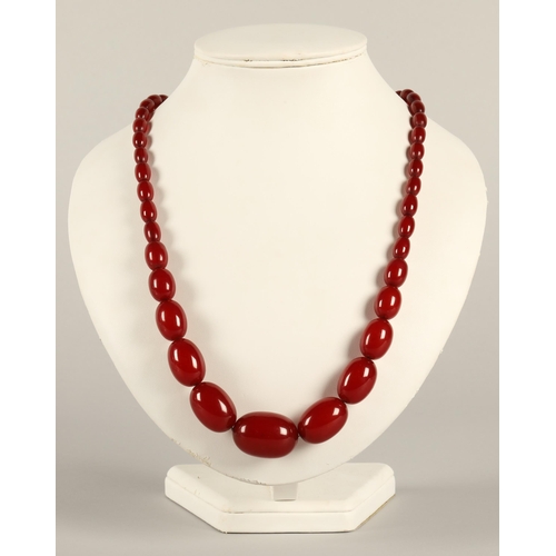 78 - Cherry amber string of graduated beads, 76cm long, 73.8g.