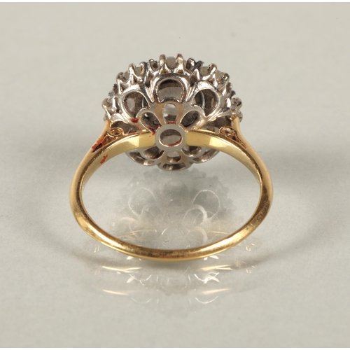 49 - Diamond cluster ring, central old cut 1 carat stone surrounded by eight 0.2 carat stones, mounted in... 