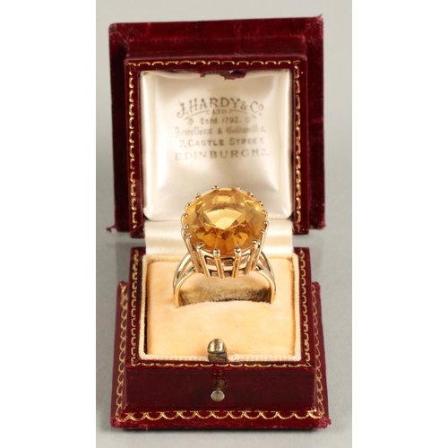 59 - Citrine dress ring 2.5cm x 1.8cm in 9ct yellow gold mount, ring size V.