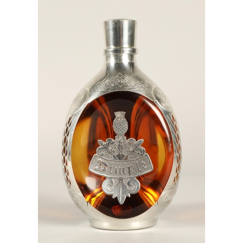 319 - Haig Dimple Royal Pewter blended scotch whisky, Contained in a decanter shaped bottle with presentat... 