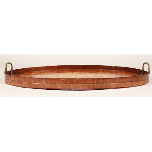 193 - 19th Century oval marquetry tray with brass handles,64cm long.