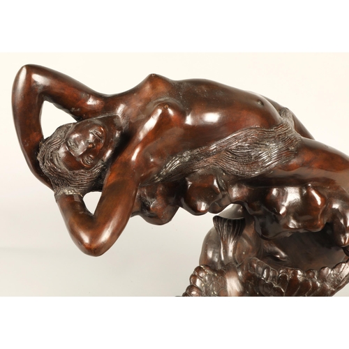 222 - Bronze sculpture of a reclining nude on a rock with bird, signed Rossi55cm high 60cm wide 20cm depth... 