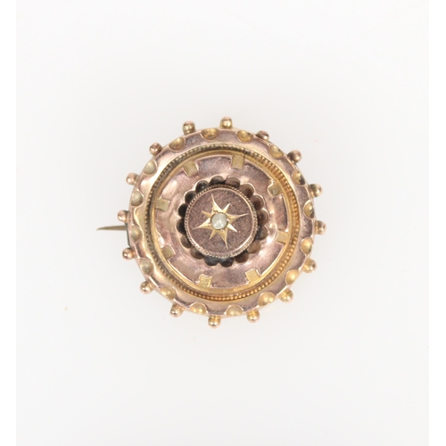 575 - Late Victorian 9ct gold brooch of round form with central seed pearl with rear glazed compartment, 2... 