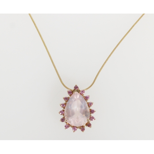 580 - Italian 9ct gold and pink stone pendant, the large pear cut pink stone within a frame of round pink ... 