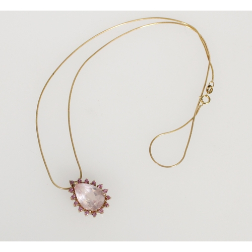 580 - Italian 9ct gold and pink stone pendant, the large pear cut pink stone within a frame of round pink ... 