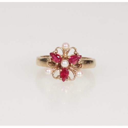 596 - 9ct gold ruby and seed pearl cluster ring, size S/T, 4.9g.