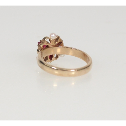 596 - 9ct gold ruby and seed pearl cluster ring, size S/T, 4.9g.