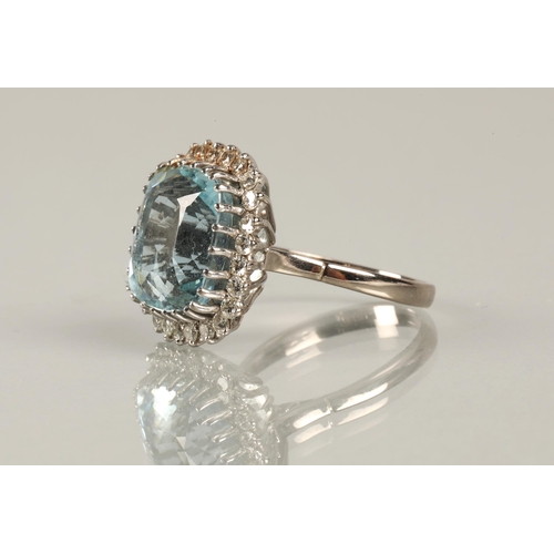 51 - Aquamarine and diamond dress ring, cushion shaped aquamarine with a border of small diamonds on 18ct... 