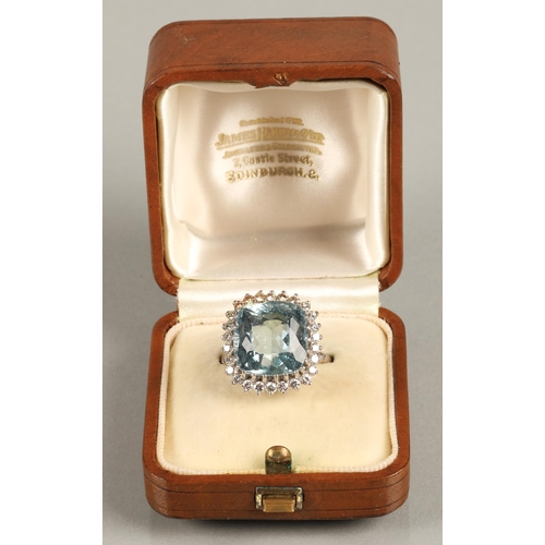 51 - Aquamarine and diamond dress ring, cushion shaped aquamarine with a border of small diamonds on 18ct... 