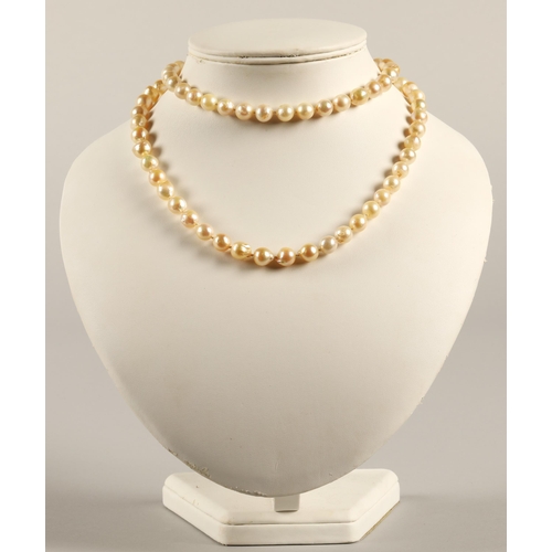 77 - Single string of cultured pearls with a Chinese14k gold clasp, 82cm long.