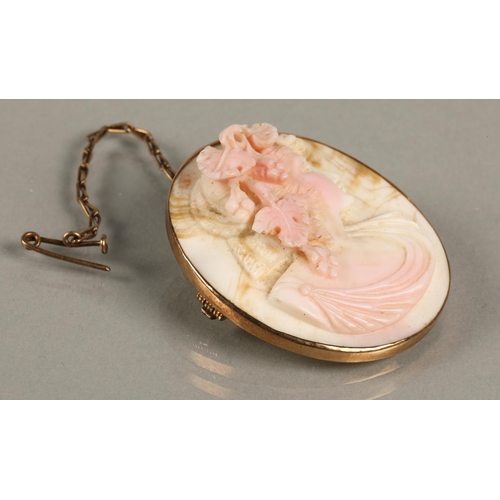 76 - Victorian carved coral cameo brooch with the bust of a woman on yellow metal mount 3.9cm x 3.5cm.