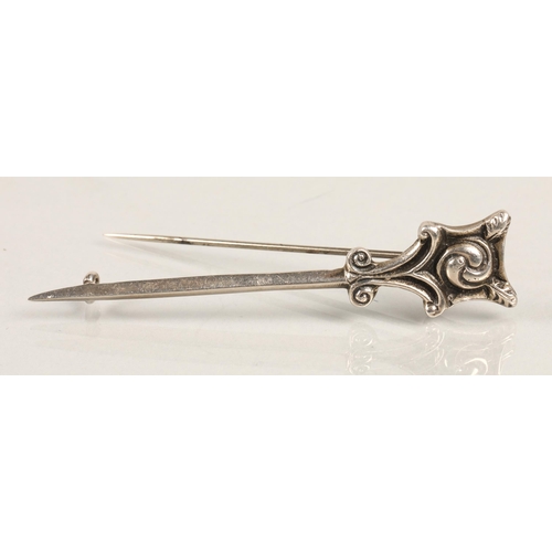 96 - Three assorted Alexander Ritchie Designed silver brooches, Norse boat, Zooamorphic bird and Celtic k... 