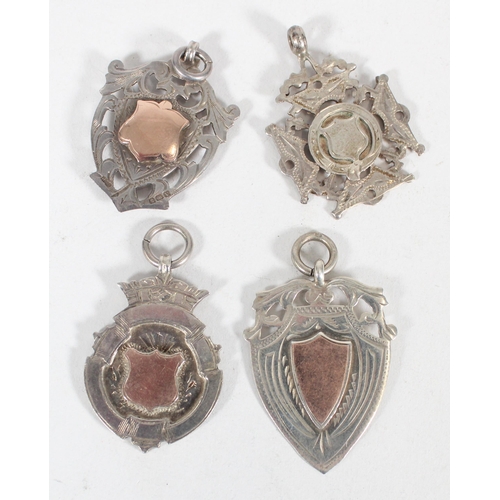 627 - Four hallmarked silver fob pendants