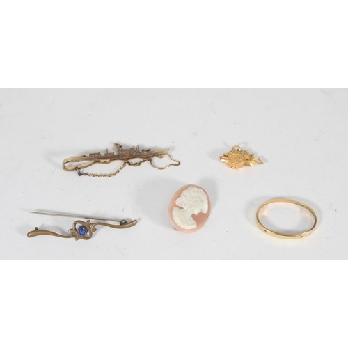 628 - Yellow metal charm of a paddle steamer, naval destroyer brooch, cameo brooch and a bar brooch (4)