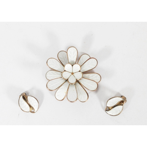 634 - Norwegian silver gilt and white enamel floral brooch and earrings set.