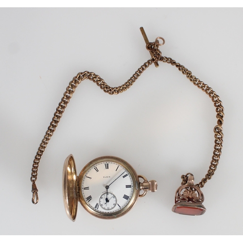 664 - Elgin gold plated pocket watch together with a plated Albert chain and plated seal fob.