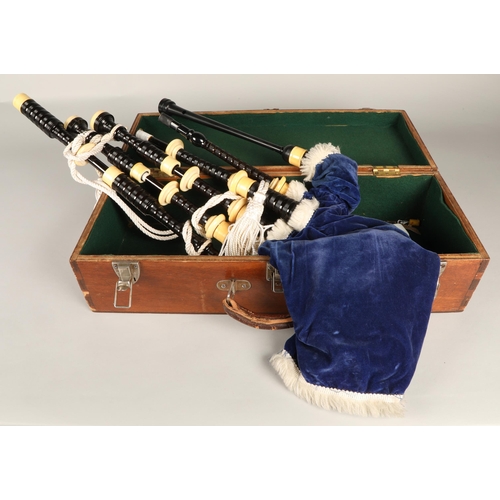 210 - Set of Ivory Mounted bagpipes, unsigned, turned black hardwood with ivory mounts, blue velvet bag in... 