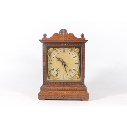 16 - Oak cased mantel clock, 31cm high.