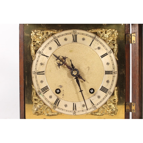 16 - Oak cased mantel clock, 31cm high.