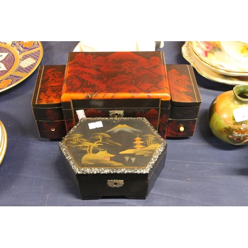 23 - Japanese style lacquer musical jewellery cabinet, and another musical jewellery box.