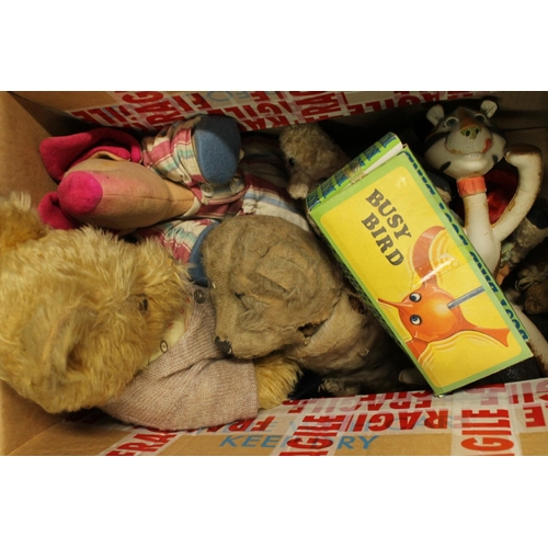 297 - Box containing vintage toys to include two teddy bears, other soft toys, and a boxed busy bird.