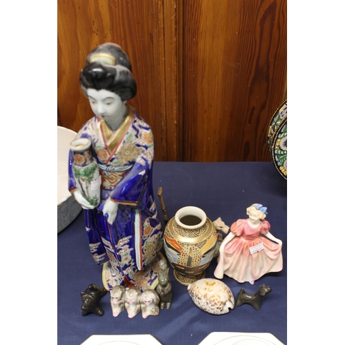 32 - Pottery figure of a Geisha, a Royal Doulton 'Sweeting' figurine and other pottery figurines, etc.