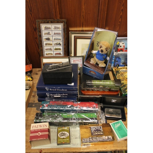 325 - Railway collectables to include four boxed Royal Doulton plates, two vintage tins, a model of The Fl... 