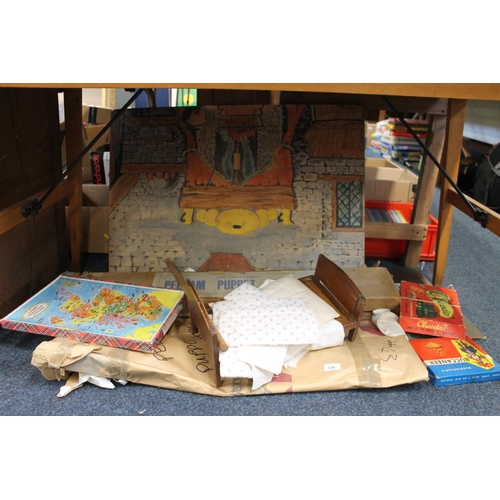 339 - Pelham puppet theatre, boxed, a vintage doll's bed and bedding, vintage board games to include Clued... 