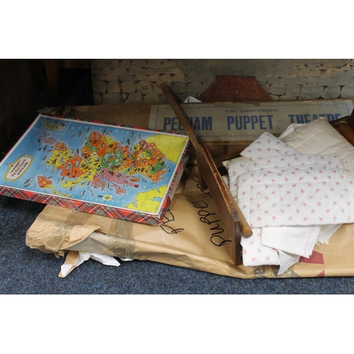 339 - Pelham puppet theatre, boxed, a vintage doll's bed and bedding, vintage board games to include Clued... 