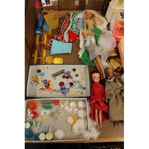 340 - Vintage Barbie doll, another, and accessories to include flatware, shoes, kitchenware, ski set and c... 