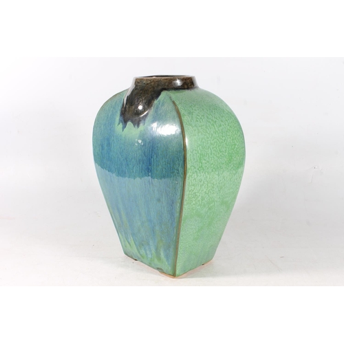 35 - High fired blue-green glaze pottery vase, 37cm high.