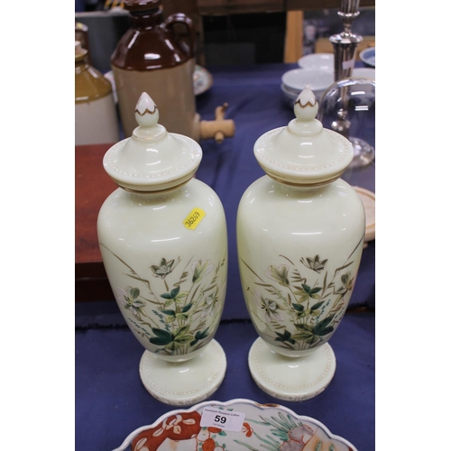 58 - Pair of 19th century opaline glass urns painted with floral decoration, 34cm high.