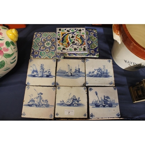 7 - Six 19th century Dutch Delft blue and white tiles, and three other tiles.