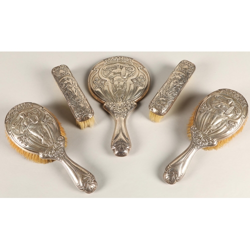 174 - Art Nouveau silver five piece dressing table set, consisting of two pairs of brushes and a hand mirr... 