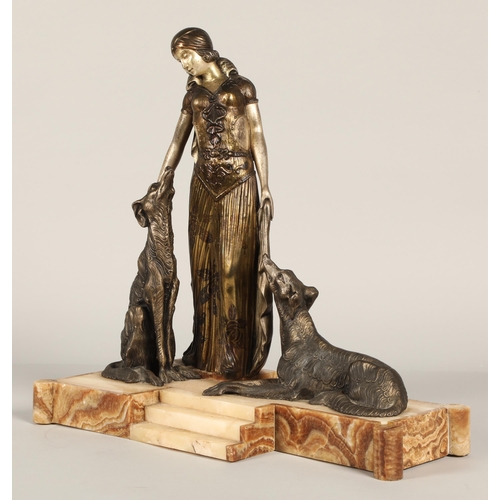 219 - After Georges Van De Voorde, Art Deco silvered and bronzed metal figure group, modelled as a lady wi... 