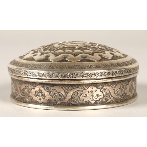 165 - Persian circular silver trinket box with embossed animal decoration.