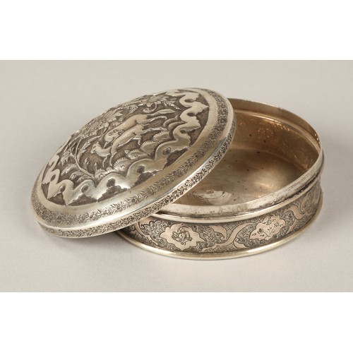 165 - Persian circular silver trinket box with embossed animal decoration.