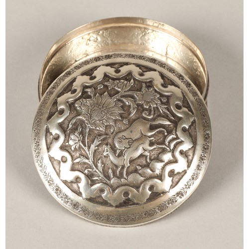 165 - Persian circular silver trinket box with embossed animal decoration.