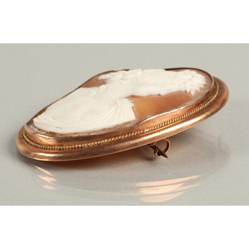 65 - Large cameo brooch mounted in 9ct rose gold, 6.5cm high 5cm wide.