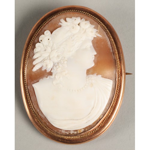 65 - Large cameo brooch mounted in 9ct rose gold, 6.5cm high 5cm wide.