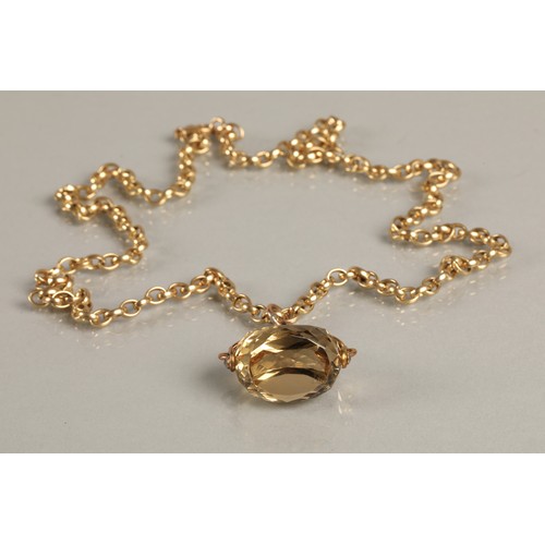 55 - 9ct yellow gold link chain with 9ct gold mounted citrine spinner fob, chain weight 24g.