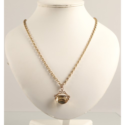 55 - 9ct yellow gold link chain with 9ct gold mounted citrine spinner fob, chain weight 24g.