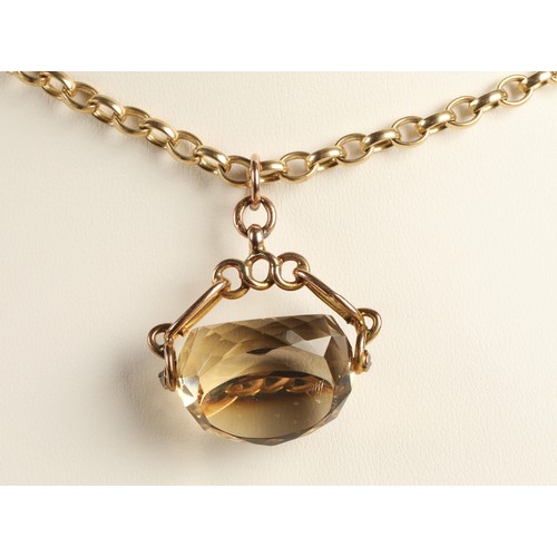 55 - 9ct yellow gold link chain with 9ct gold mounted citrine spinner fob, chain weight 24g.